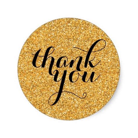 A Gold Thank Sticker With The Words Thank You Written On It In Black Ink