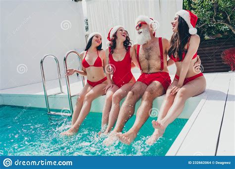Photo Of Funny Funky Santa Claus Snow Maidens Wear Red Bikinis Enjoying