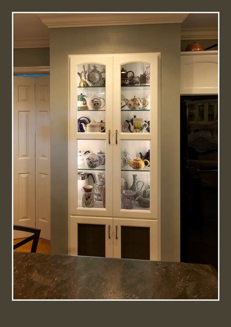 This beautiful breakfront kingwood display cabinet has a central wide door flanked by two glazed panels enclosing a mirrored interior. Tea Pot display cabinet - Traditional - Kitchen - Other ...