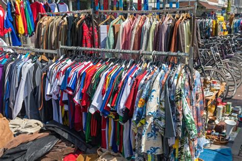 Many Clothes In The Hangers In A Flea Market Stock Image Image Of