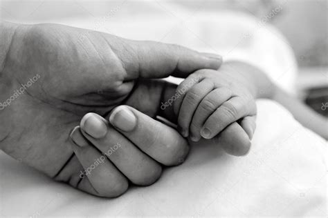 Babys Hand Holding Mothers Finger — Stock Photo © Photobac 5369538