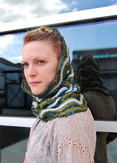 Combining simple stockinette stripes with a central feather & fan lace panel and border, the mitered shawlette is the perfect about this pattern. Ravelry: Rococo Shibori Cowl pattern by Gina Wilde