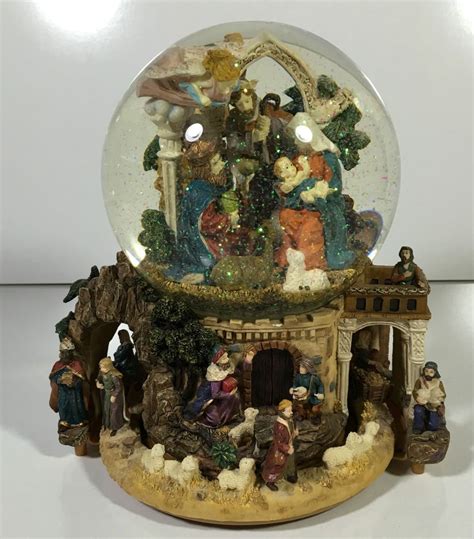 Santa and train turn while the christmas tune plays. Vintage Christmas Nativity Scene Snow Globe Music Box ...