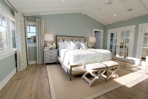 Soft lighting, proper window treatments, and soothing paint colors are always recommended. Steely light blue bedroom walls, wide-plank rustic wood ...