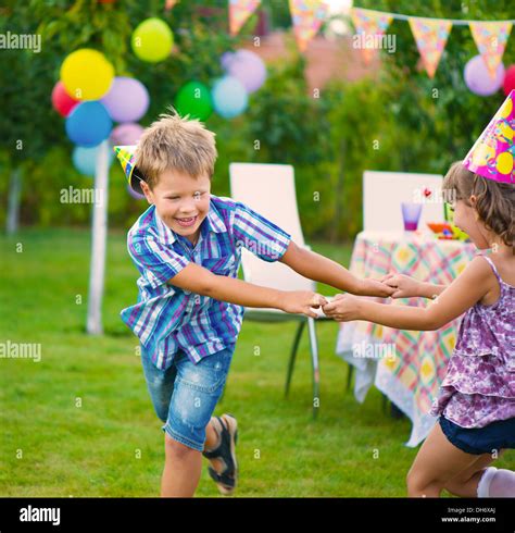 Two Little Kids Celebrating Birthday Dancing Roundelay Stock Photo Alamy