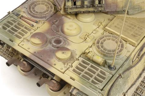 A Close Up Of A Toy Tank On A White Surface