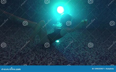 beautiful girl swim underwater into night waterpool with lights stock video video of dark