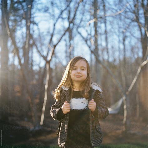 Beautiful Young Girl On A Coat Standing Outside By Stocksy