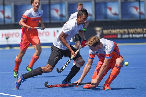 The object is to propel a vulcanized rubber disk, the puck, past a goal line and into a net guarded by a goaltender, or goalie. Photos: Canada vs Netherlands - June 19/17 - Field Hockey ...