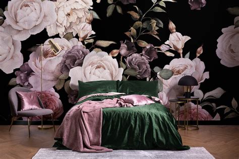 a bedroom with floral wallpaper and green velvet bedding in front of a black background