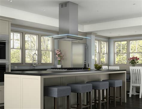 An aged bronze chandelier hangs atop the reclaimed pine wood kitchen counter and is matched by the bronzed stovetop and range hood. 4 Types of Kitchen Range Hoods to Transform Your Kitchen