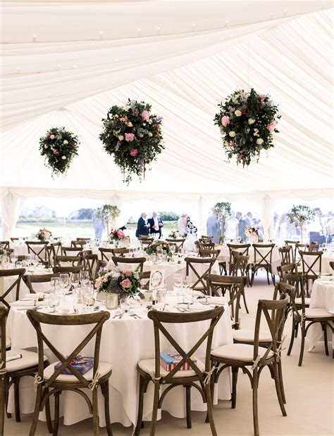Hanging Flowers Look Fab In The High Ceiling Of A Wedding Marquee