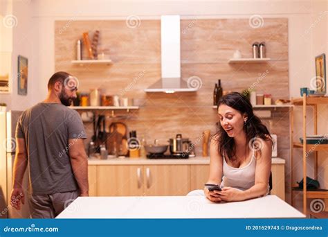 Unfaithful Wife Chatting Near Husband At Home Stock Image Image Of