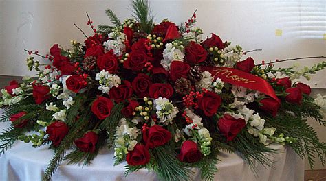Order beautiful casket sprays & casket flowers from teleflora. Christmas Seasonal Casket Spray | Casket flowers ...