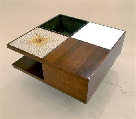 The table top is crafted from layered plywood with a melamine layer completing the top. Multifunctional Coffee Table by Vladimir Kagan at 1stdibs
