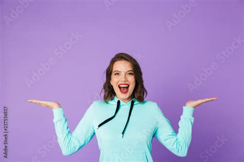Beautiful Young Woman Posing Isolated Over Purple Background Wall