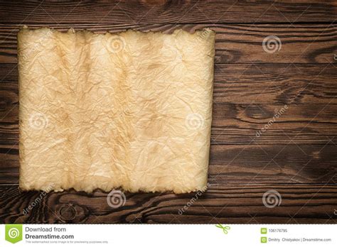 Old Vintage Paper With Torn Edge On Brown Wood Planks Stock Image