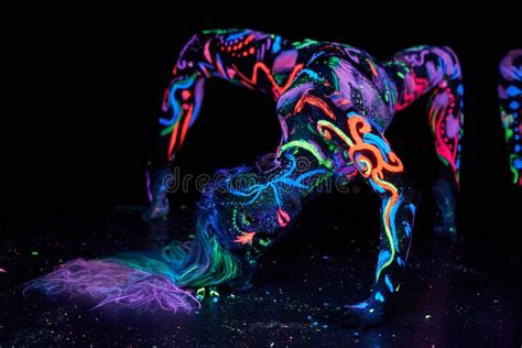 Art Woman Body Art On The Body Dancing In Ultraviolet Light Bright Abstract Drawings On The