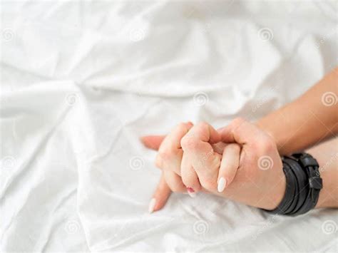 Close Up Hands Of A Couple Make Love Hot Sex On A Bed Stock Image