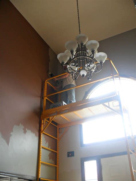 I don't mind to paint, but when you have to break almost your neck to reach high with your role on a pole its is less i used to paint the walls in my house but i asked someone to paint the ceilings. Western Warmth: Painting those High Ceilings