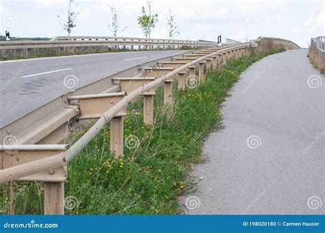 A Crash Barrier Between A Road And A Footpath Stock Photo Image Of