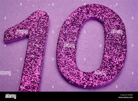 Number Ten Purple Color Over A Purple Background Anniversary