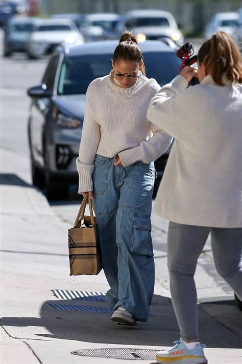 Jennifer Lopez Looks Cool In A Turtleneck Sweater And Baggy Jeans While