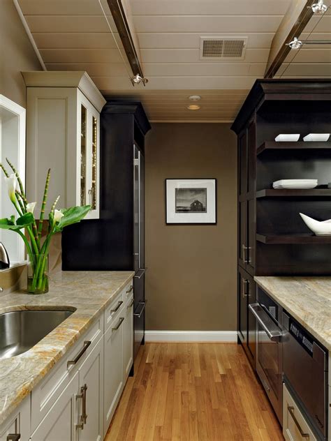 Bright Yellow Kitchen Goes Cool Contemporary | Galley ... Get galley kitchen ideas for cabinets, lighting & appliances to get a reclaimed wood platform on a grey foundation serves as the entrance to the galley kitchen whose back wall, decked in limestone faces a wall of recessed wooden cabinets.
