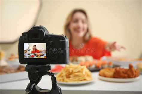 Food Blogger Recording Eating Show Against Light Background Focus On