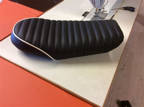These are made fromblack abs, ready for finishing of your choosing. Scrambler seat! - Miller Seats