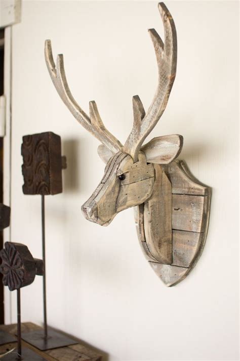 The Kalalou Recycled Wooden Deer Head Wall Hangingwill Give An Eye