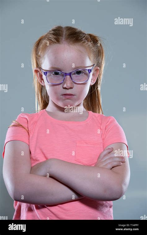 A Bored Young White Girl With Glasses And Red Hair Stock Photo Alamy