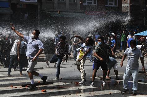 Nepal Protesters Defy Virus Lockdown Clash With Riot Police Ap News