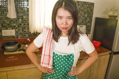 Domestic Chores Lifestyle Portrait Of Young Tired And Stressed Asian
