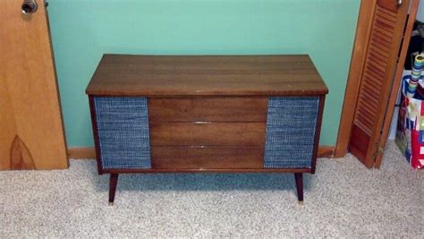 Small for that time period and sits on legs about 6 inches off the floor. Vintage stereo console turned into storage chest ...