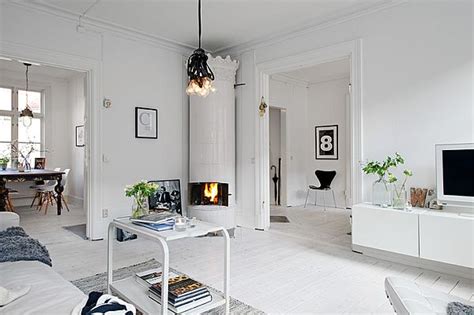 Scandinavian style decor inspiration explored through 3 simple home interior schemes. Inviting White Swedish Apartment With Vintage Fireplaces
