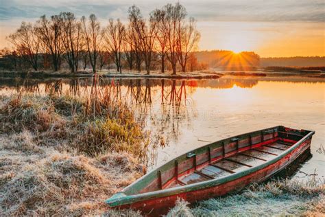 Rowing Fishing Boat At Beautiful Sunrise In Autumn Morning Stock Image