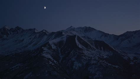4k Stock Footage Aerial Video The Moon Over The Snow Covered Chugach