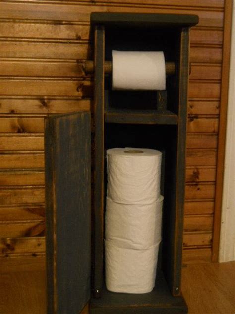 Repurposed magazine holder turned toilet paper storage. Primitive Farmhouse toilet paper holder. $44.99, via Etsy ...