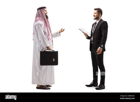 Full Length Profile Shot Of An Arab Businessman Talking To A Man In A