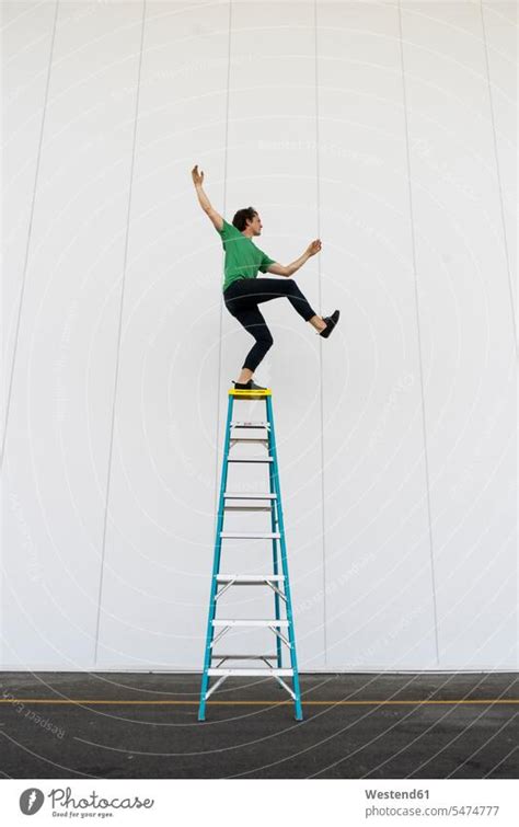 Acrobat Balancing On Ladder A Royalty Free Stock Photo From Photocase