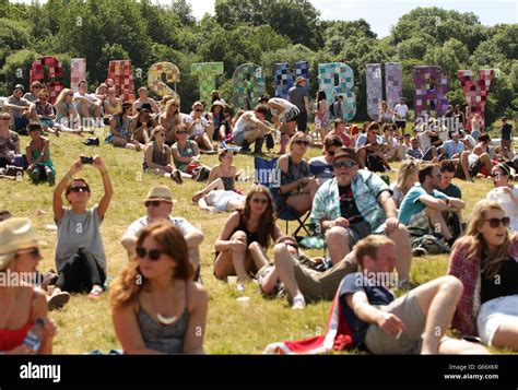 Festival Goers Enjoying The Hot Weather At The Glastonbury Festival At