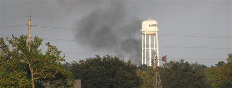 Smoke Is Seen Rising From The Arkema Chemical Manufacturing And Storage