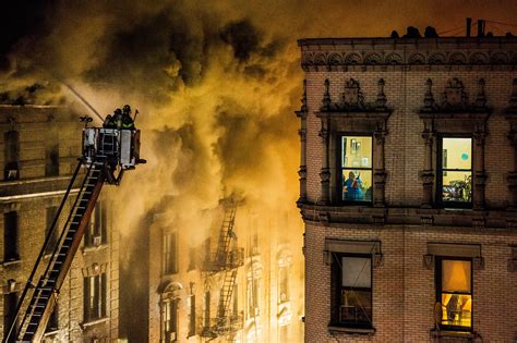 man arrested in upper manhattan building fire that displaced dozens the new york times