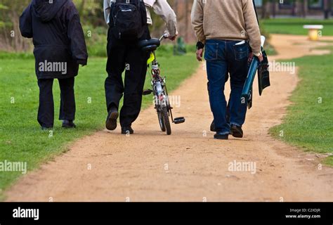 Three People Walking Stock Photo Alamy