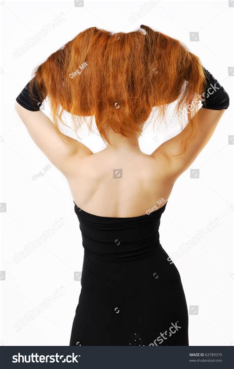 Woman Is Standing Back With Raised Hair She Has Lifted Up