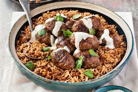 In my recipe, tender seasoned ground lamb is served with turmeric rice and topped with lettuce, tomato, spiced. Middle Eastern lamb koftas with aromatic lentil rice