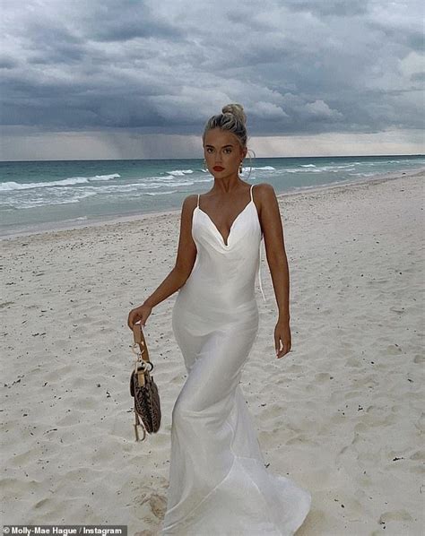 molly mae hague opts for bridal chic in slinky white gown as she poses on beach
