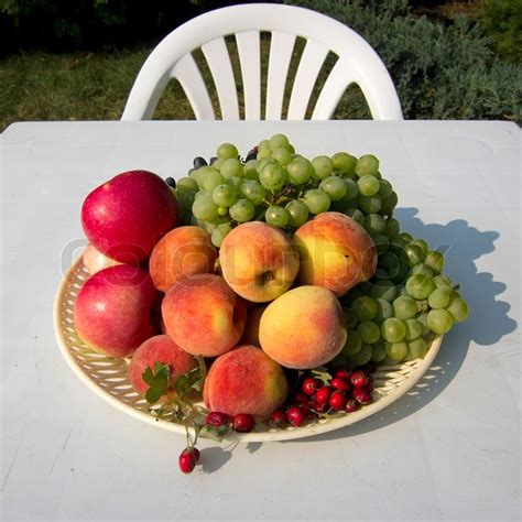 Mix Of Fresh Fruits On A White Table Stock Photo Colourbox