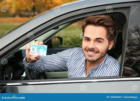 Young Man Holding Driving License Stock Photo Image Of Permission